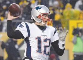  ?? The Associated Press ?? New England Patriots quarterbac­k Tom Brady throws a pass during first-half NFL action against the Pittsburgh Steelers in Pittsburgh last Sunday. The Patriots won 27-24.