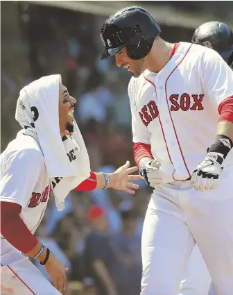  ?? AP FILE PHOTO ?? QUITE THE PAIR: Mookie Betts and J.D. Martinez — shown earlier this season — will likely split plenty of MVP votes this year, but they’ve absolutely split the affection of manager Alex Cora.