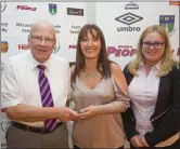  ??  ?? Jim McLaughlin of the Wicklow League and Nicole Franey of the Parkview Hotel present the John Tobin Youth Player of the Year award to Liz Cuddihy who accepted the award on behalf of Oisin O’Reilly of Wicklow Town AFC.