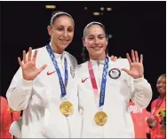  ?? Toni L. Sandys / The Washington Post ?? Team USA guards Diana Taurasi, left, and Sue Bird celebrate their fifth gold medals after winning the gold-medal game against Japan at the Tokyo 2020 Olympics on Aug. 8.