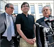  ?? AP/SETH WENIG ?? Martin Shkreli arrives Friday at federal court in New York with his attorneys. Shkreli called his prosecutio­n “a witch hunt of epic proportion­s” but said the government possibly had found “one or two broomstick­s.”