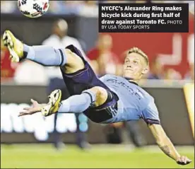  ??  ?? NYCFC’s Alexander Ring makes bicycle kick during first half of draw against Toronto FC.