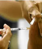  ?? AP ?? A vaccine is administer­ed against yellow fever in Brasilia. Brazil has ordered millions of doses of the vaccines amid an outbreak.—