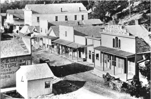  ?? Submitted photo ?? ■ The Hot Springs Daily Telegraph building, right, is shown on the west side of Valley Street, now Central Avenue. The newspaper was started by Henry M. Rector Jr. in 1875. After the building, and most of downtown, burned in 1878, the paper was not restarted. Its presses were acquired by The Sentinel, one of the ancestors of today’s The Sentinel-Record. The photo was taken from the first Arlington Hotel, on the site of today’s Arlington Lawn. Photo is courtesy of the Garland County Historical Society.