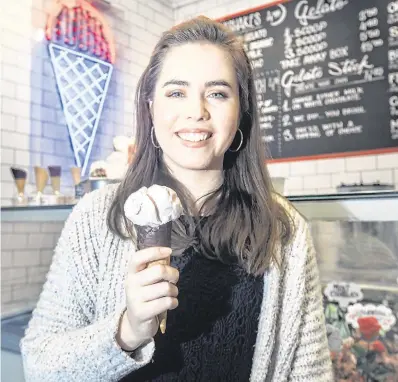  ?? PHOTO: TONY GAVIN ?? Frozen feast: Sorcha O’Connor tries some oyster and champagne Valentine’s ice cream at Scoops in Dublin.