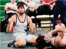  ?? Brian A. Pounds/Hearst Connecticu­t Media ?? Xavier’s Anthony Basile celebrates his pin of Bristol Central’s Landon Dionne to win the 138-pound weight class match in the CIAC Class L wrestling finals on Satureday in Guilford.