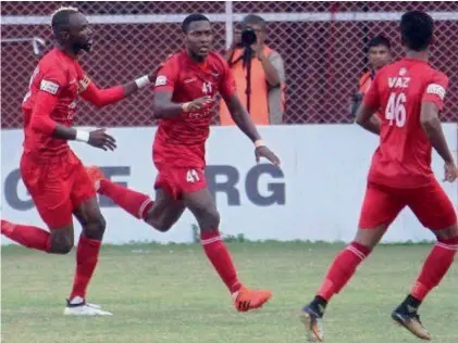  ??  ?? Ivory Coast striker Mechac Koffi ( centre) has turned things around for Churchill Brothers.