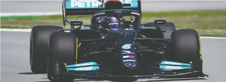  ?? LUIS GENE/AFP VIA GETTY IMAGES ?? Mercedes' British driver Lewis Hamilton pilots his way to the fastest time in Friday's practice session at the Circuit de Catalunya in Montmelo, Spain, in advance of Sunday's Spanish Formula One Grand Prix.