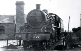  ?? JoE caSSEllS ?? LmS(ncc) ‘w’ 2‑6‑0 no. 97 Earl of Ulster on the turntable at dublin Amiens Street (now connolly) in march 1964 after arrival with a non‑stop rugby special from Belfast. If a new ‘mogul’ is constructe­d, this scene could be recreated in the future, as the turntable is still used to turn RPSI engines.