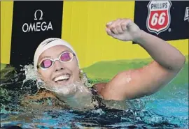  ?? Chris Carlson Associated Press ?? “I JUST AM sort of on cloud nine right now,” Kathleen Baker said after setting a world record in the women’s 100-meter backstroke at Irvine.