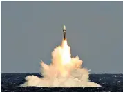  ??  ?? A test firing from HMS Vigilant of an unarmed Trident II (D5) missile – the cost of replacing the system will be around £31 billion