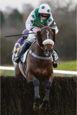  ?? ALAN CROWHURST/GETTY IMAGES ?? Got Away, with Leighton Aspell up, clears the last on the way to winning the Maresâ Steeple Chase at Leicester yesterday