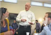  ?? Justin Sullivan / Getty Images ?? Montana GOP candidate Greg Gianforte, center, left his final campaign rally without giving a speech.