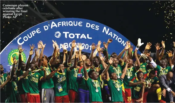  ??  ?? Cameroon players celebrate after winning the final against Egypt Photo: AP