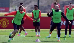  ?? — AFP ?? Manchester United’s Daley Blind (left) and Wayne Rooney at practice on Wednesday.