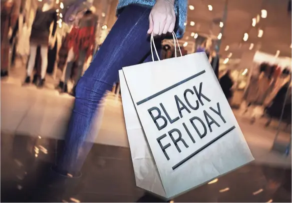  ?? GETTY IMAGES ?? If you absolutely can’t miss Black Friday, consider safeguards such as paying with cash instead of a card.