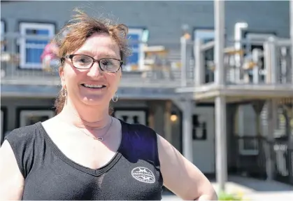  ?? KEITH GOSSE • THE TELEGRAM ?? Christine Gillespie of Chafe’s Landing stands in front of the Petty Harbour restaurant Thursday afternoon.