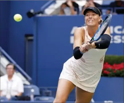  ?? ADAM HUNGER — THE ASSOCIATED PRESS ?? Maria Sharapova returns a shot from Timea Babos during the first round of the U.S. Open tennis tournament, Wednesday. Sharapova will play her third straight match on Arthur Ashe Stadium Friday and players are not happy about it.