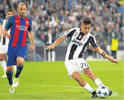  ?? Picture: Getty Images. ?? Paulo Dybala fires home his and Juventus’s second goal of the night before half-time.