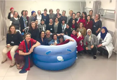  ?? (Sister Valentina) ?? STAFF FLANK (and get comfortabl­e in) one of the hospital’s new birthing pools.