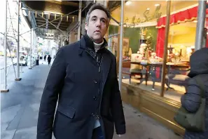  ?? AP Photo/Richard Drew ?? ■ Michael Cohen, former lawyer to President Donald Trump, leaves his apartment building Friday on New York’s Park Avenue. In the latest filings Friday, prosecutor­s will weigh in on whether Cohen deserves prison time and, if so, how much.