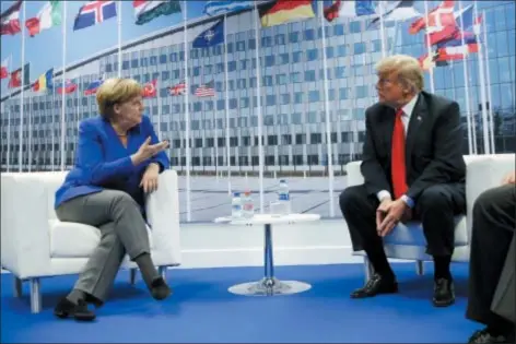  ?? ASSOCIATED PRESS ?? President Donald Trump meets with German Chancellor Angela in Brussels, Belgium, on Wednesday. Merkel during their bilateral meeting at the NATO Summit