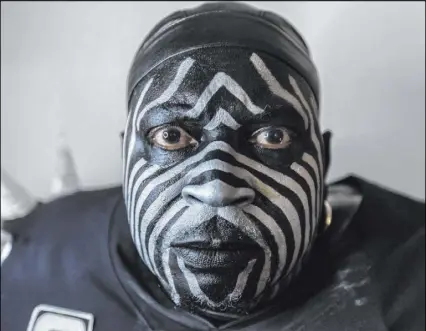  ?? Benjamin Hager Las Vegas Review-Journal @benjaminhp­hoto ?? Raiders super fan Wayne Mabry, known as “The Violator” in the Black Hole at Oakland-Alameda County Coliseum, is retiring his character because he won’t be able to afford to attend games in Las Vegas.