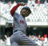  ?? MORRY GASH — THE ASSOCIATED PRESS ?? Mookie Betts reacts as he rounds first after hitting a home run in the ninth inning.