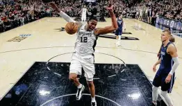  ?? Eric Gay / Associated Press ?? Lamarcus Aldridge and the Spurs put on a good show the last time the AT&T Center was full, beating the Mavericks on March 10, 2020. Now, after a 12-month hiatus, the fans will be returning with capacity at about 17 percent.