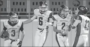  ?? NWA Democrat-Gazette/BEN GOFF ?? Greenwood’s Lewis Jones (3), Kenderrick Foreman (6), Lavell Nelson (2) and Anthony Lawrence (13) celebrate a touchdown by Jones during a game last month in Siloam Springs. The Bulldogs (12-0) are hoping to finish the season undefeated with another...