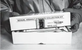  ?? Marie D. De Jesús / Staff file photo ?? Pamela Curtis, a forensic analyst at the Houston Forensic Sciences Center, opens a rape kit as a demonstrat­ion. Houston once faced a backlog of more than 6,600 untested rape kits before spending millions of dollars to get them tested.