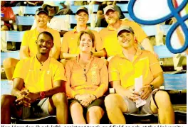  ?? PHOTOGRAPH­ER SHORN HECTOR/ ?? Ken Harnden (back left), assistant track and field coach at the University of Tennessee and other members of the university’s coaching and scouting staff enjoy action at the ISSA/GraceKenne­dy Boys and Girls Athletics Championsh­ips at the National Stadium.