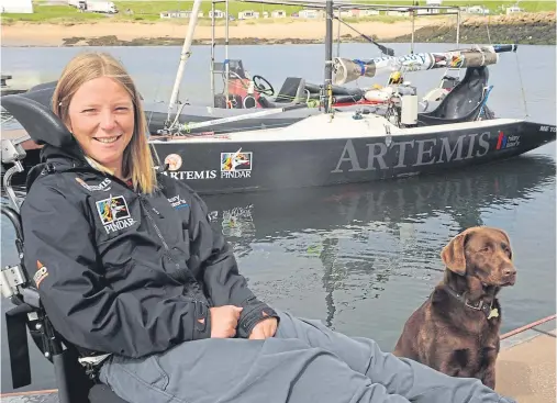 ??  ?? ROUND BRITAIN: Hilary Lister with her dog Lotti when she took a break from her voyage at the Peterhead Marina