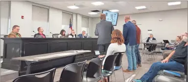  ?? Blake Silvers ?? Gordon County commission­ers hear from developers during a public hearing concerning a large single family housing developmen­t in Sonoravill­e.