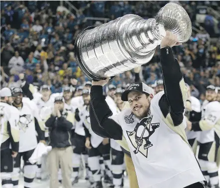  ?? — THE CANADIAN PRESS FILES ?? The Pittsburgh Penguins will open defence of their Stanley Cup championsh­ip Thursday night without Sidney Crosby, who suffered a concussion in practice last week.