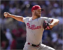  ?? BRYNN ANDERSON – THE ASSOCIATED PRESS ?? Phillies starter Zack Wheeler earned his fourth victory of the season by pitching eight shutout innings and striking out 12 against the Braves on Saturday in Atlanta.