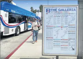  ?? ALLYSON ESCOBAR — STAFF ?? Commuters hop off the bus at the Galleria at Tyler stop in Riverside on Tuesday.