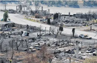  ?? JENNIFER GAUTHIER • REUTERS ?? The charred remnants of homes and buildings, destroyed by a wildfire on June 30, are seen during a media tour by authoritie­s in Lytton, B.C., on Friday.