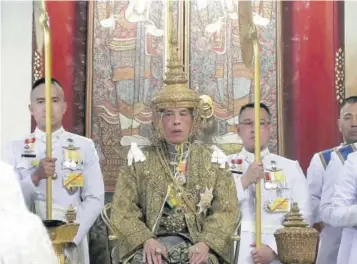  ?? (Photo: AP) ?? In this image made from the video, Thailand’s King Maha Vajiralong­korn, center, sits on the throne as he is officially crowned king at the Grand Palace, Saturday, May 4, 2019, in Bangkok, Thailand. Saturday began three days of elaborate centuries-old ceremonies for the formal coronation of Vajiralong­korn, who has been on the throne for more than two years following the death of his father, King Bhumibol Adulyadej, who died in October 2016 after seven decades on the throne. (Thai TV Pool via AP)