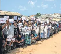  ??  ?? Rohingya Muslims as they await the UN team