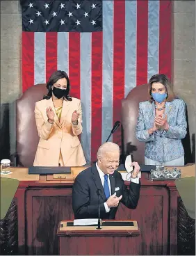  ?? AFP ?? US President Joe Biden arrives to address a joint session of Congress as Vice-President Kamala Harris (left) and House Speaker Nancy Pelosi (right) look on in the chamber of the Capitol in Washington.