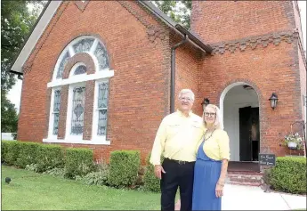  ?? LYNN KUTTER ENTERPRISE-LEADER ?? Robert and Mary Dennis of Farmington own the former Walnut Grove Presbyteri­an Church on Highway 170 and have spent the past year remodeling the church to be used as a wedding chapel and hopefully for future church services.