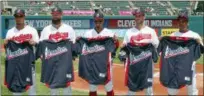  ?? RON SCHWANE — THE ASSOCIATED PRESS ?? Michael Brantley, Corey Kluber, Francisco Lindor, Yan Gomes and Jose Ramirez hold their All-Star jerseys before playing the Yankees on July 15 at Progressiv­e Field. Trevor Bauer was warming up for the game and is not pictured.