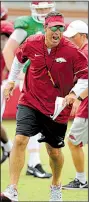  ?? NWA Democrat-Gazette/ANDY SHUPE ?? Offensive coordinato­r Dan Enos’ full playbook won’t be on display today during the Arkansas Razorbacks’ first major scrimmage of the fall.