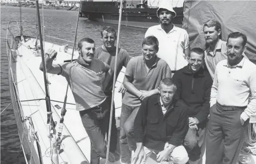  ??  ?? below: The Ondine crew in more tranquil times— seven hot-shot sailors and Captain Sven (kneeling, bottom center). The author is third from left.