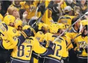  ?? PHOTOS BY THE ASSOCIATED PRESS ?? Nashville players celebrate during the third period.