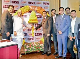  ??  ?? Officials of Kolkata-based Dollar Industries Limited hit the opening bell on April 21, when the company’s stock got listed on National Stock Exchange (NSE) in Mumbai.