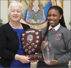  ??  ?? Samantha Chigwedere recieves the Orla Treacy Award for Third Year Student of the Year from Sr Phil Murphy.