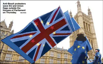  ?? REUTERS ?? Anti-Brexit protesters wave EU and Union flags outside the Houses of Parliament on Thursday.