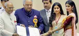  ?? AP ?? President Ram Nath Kovind confers the Best Actress award posthumous­ly on Sridevi, received by her husband Boney Kapoor and daughters Janhvi Kapoor and Khushi Kapoor at the National Film Awards ceremony in New Delhi on Thursday. Union Minister...